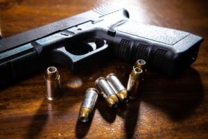 Handgun and ammunition illustrating federal firearms crimes defended by Simmrin Law Group